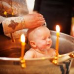 baby in the baptismal font