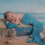 Newborn dressed as a mermaid