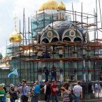 Trinity Cathedral of the Trinity-Sergius Lavra is covered with nets and scaffolding